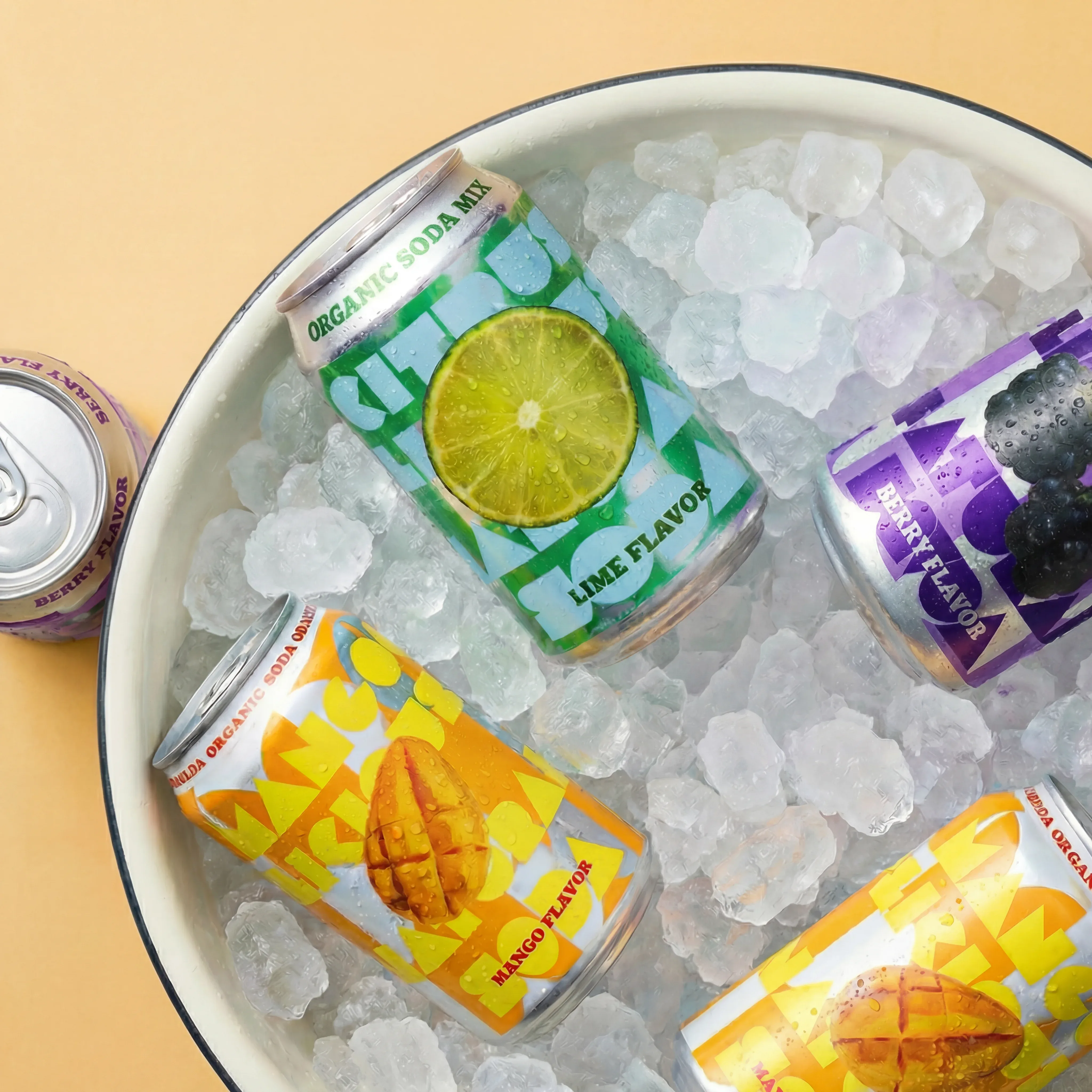 Canned drinks on ice in a studio scene.