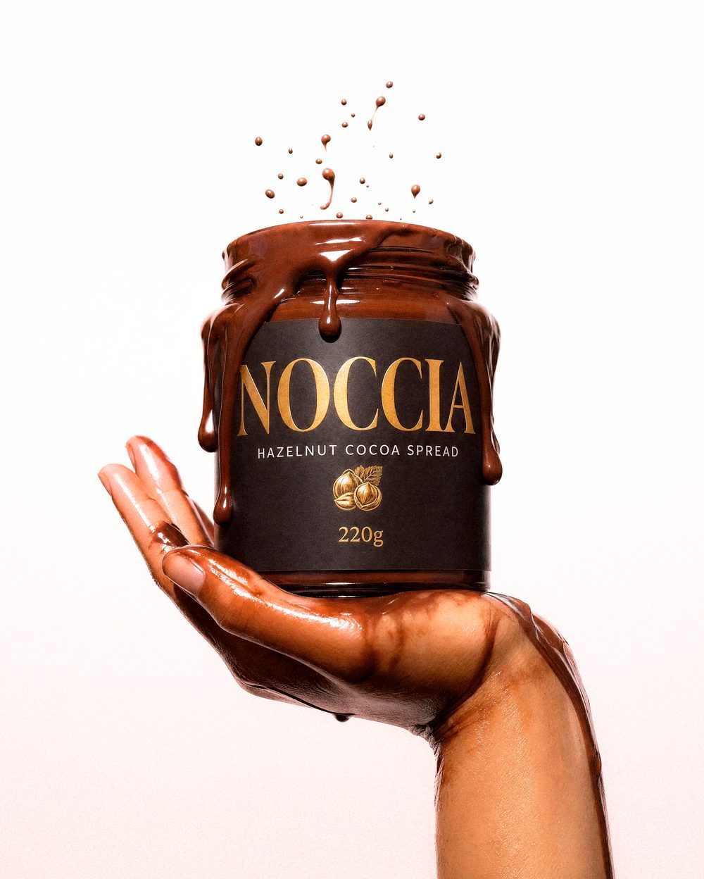 Hand holding a NOCCIA jar overflowing with glossy cocoa spread