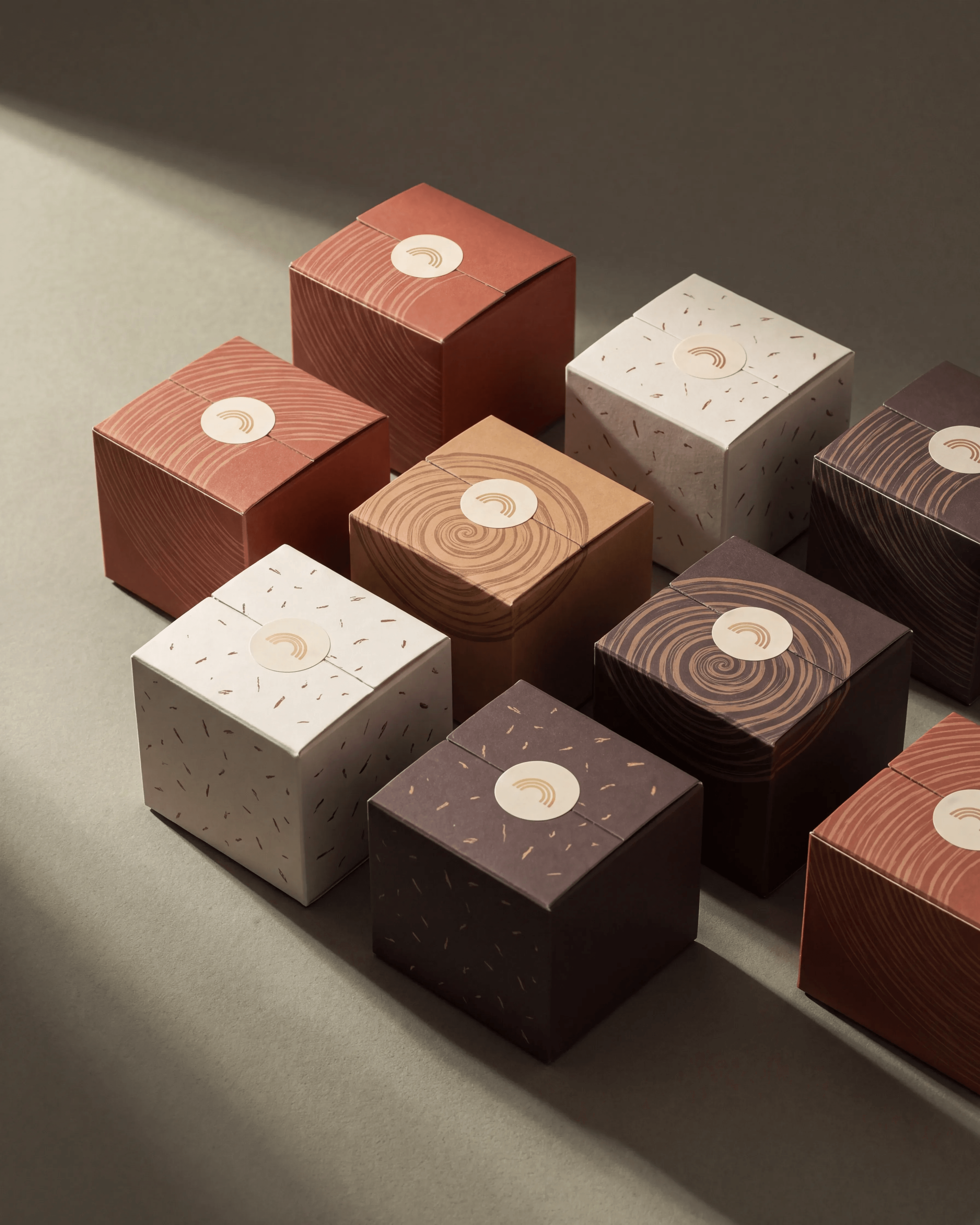 DORÉ: The Set — Gift boxes printed with lamination-derived patterns, sealed with the arc