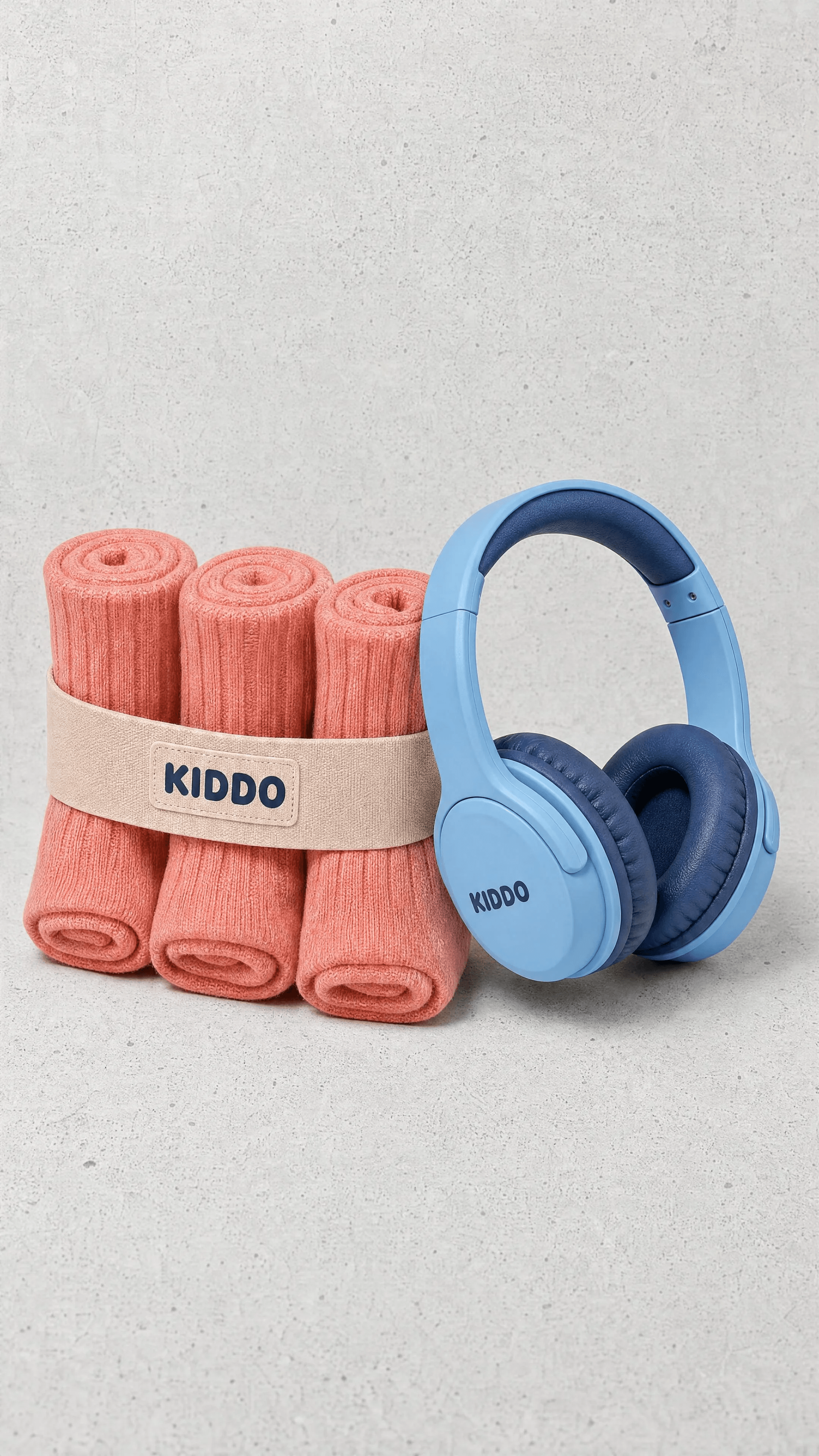 Coral socks and sky-blue headphones paired on textured concrete.