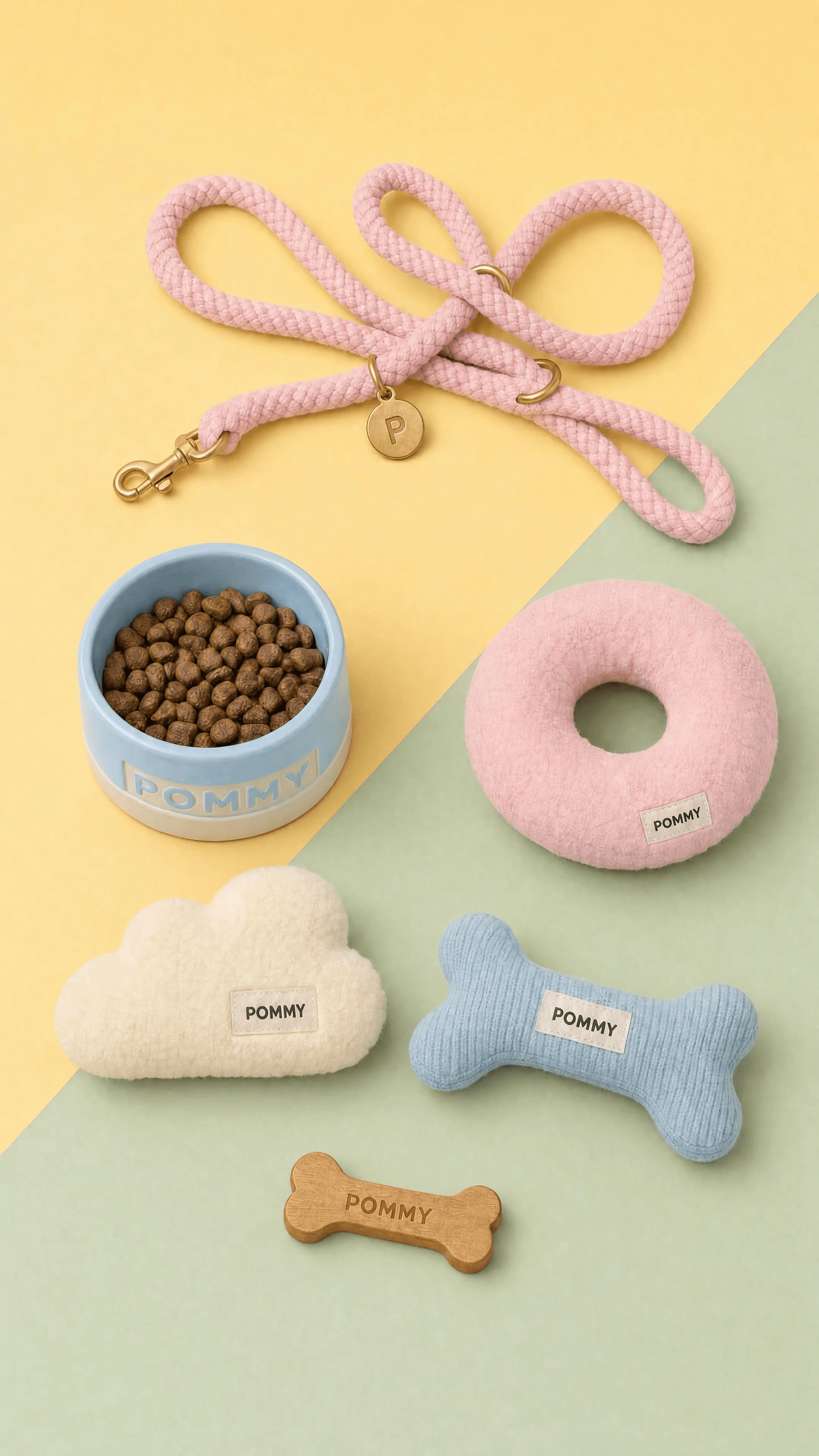 POMMY dog accessories arranged on a butter-yellow and sage-green diagonal flat lay