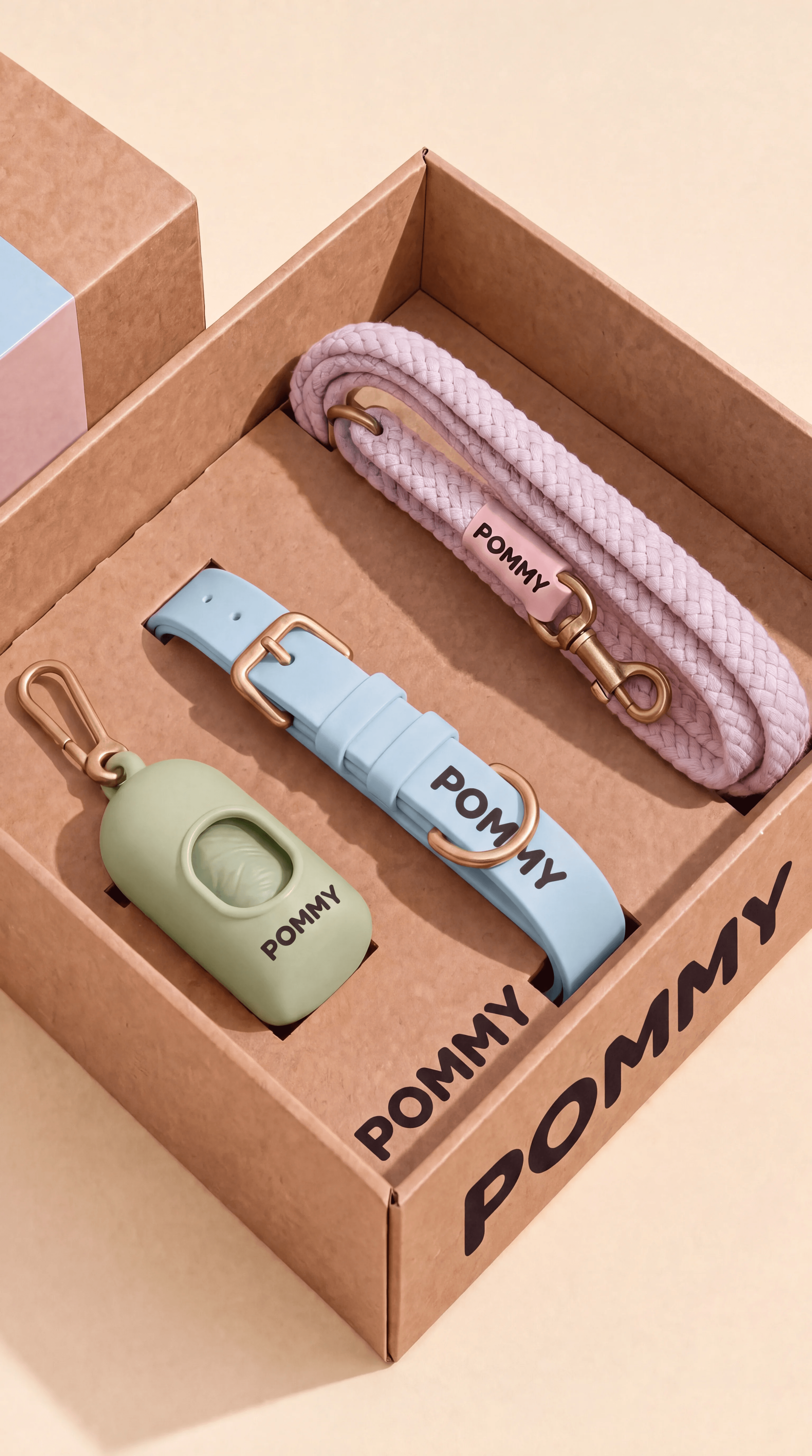 Open POMMY gift box containing a pastel rope leash, court collar, and dispenser, variation two