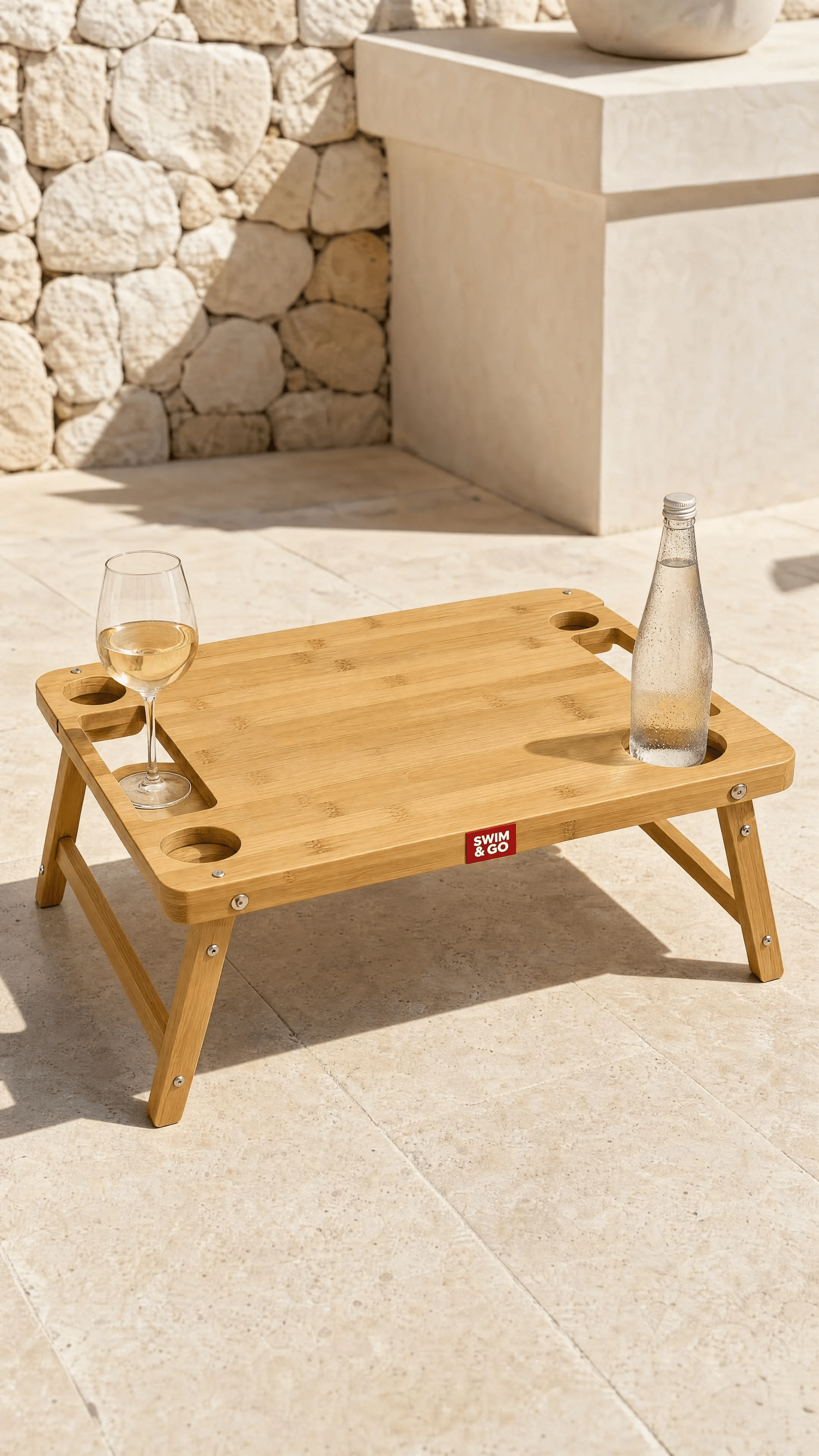 SWIM & GO bamboo picnic table set with wine and a chilled bottle