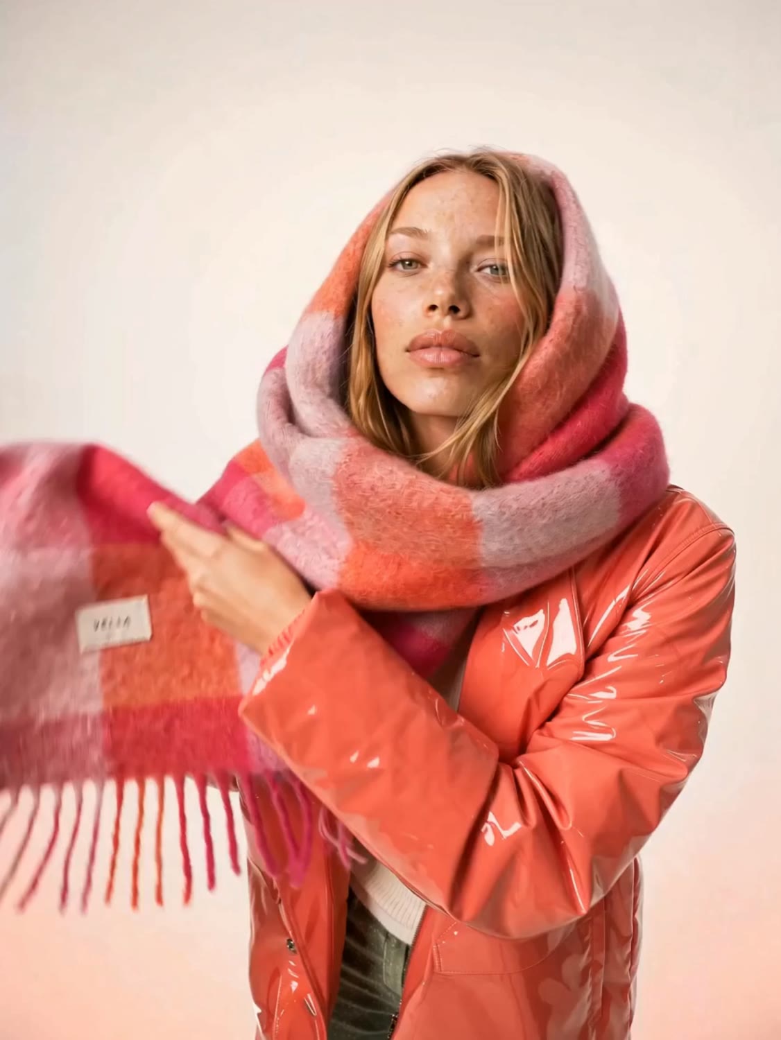 Model wrapped in a VELLA FRESA cape for an overhead beauty portrait