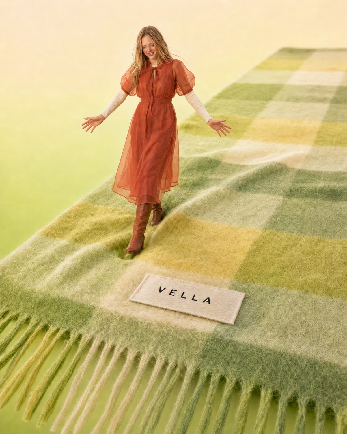 Model walking across a giant green VELLA LIMA cape
