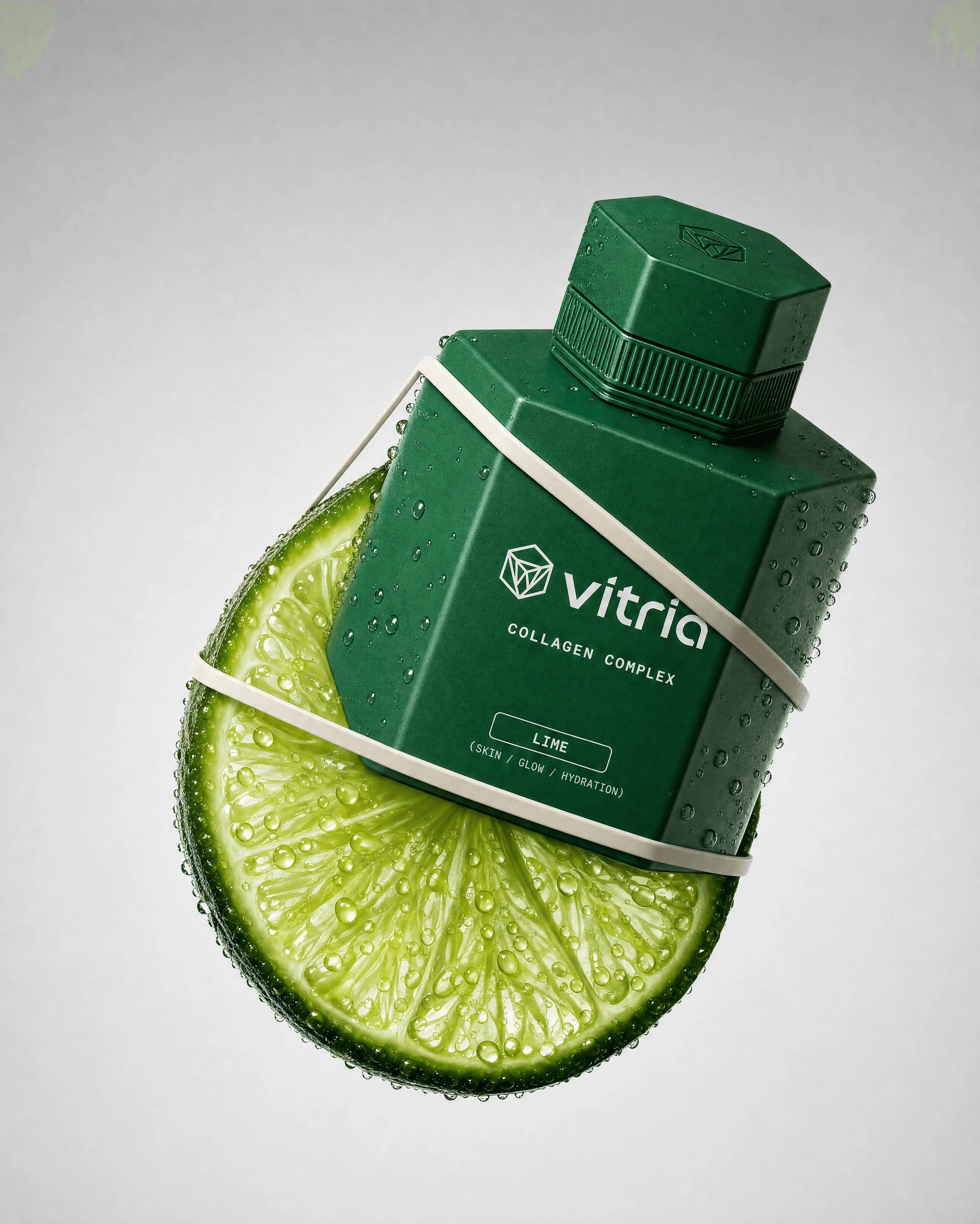 VITRIA: The First Cut — Hero shot — the Lime bottle wrapped in a citrus slice
