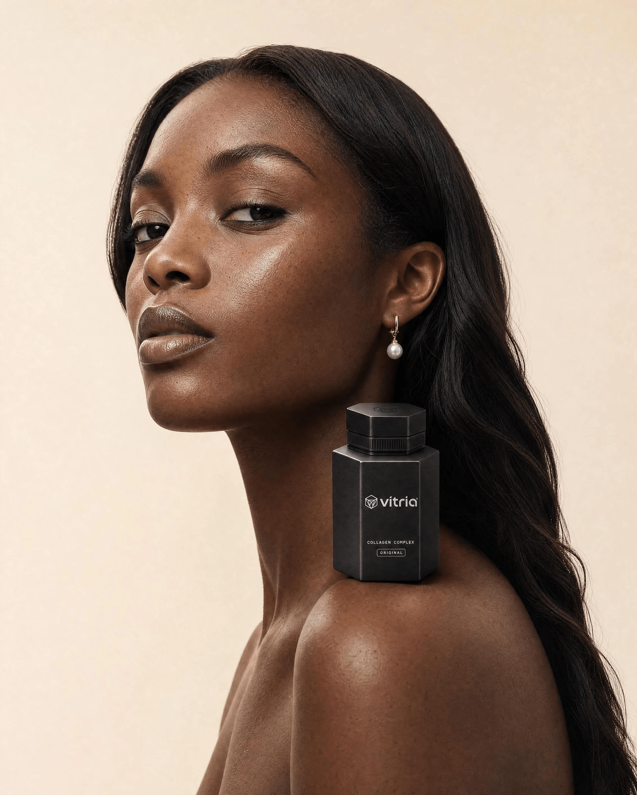 VITRIA: Worn Like Jewelry — A quiet portrait with the Original bottle at the collarbone